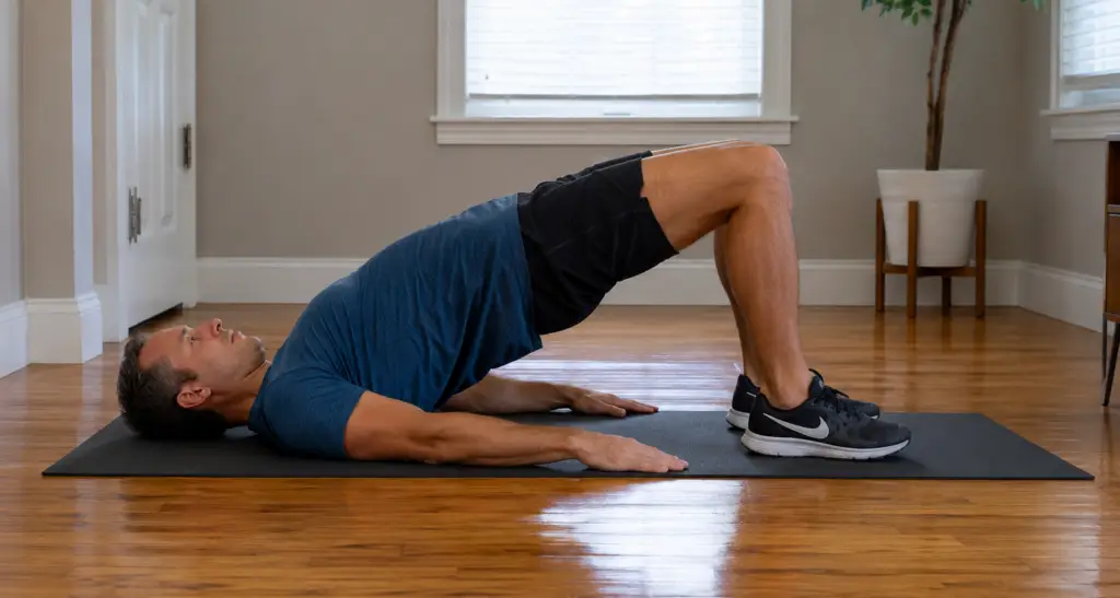 person doing glute bridge exercise to relieve sore bum bones and glute pain